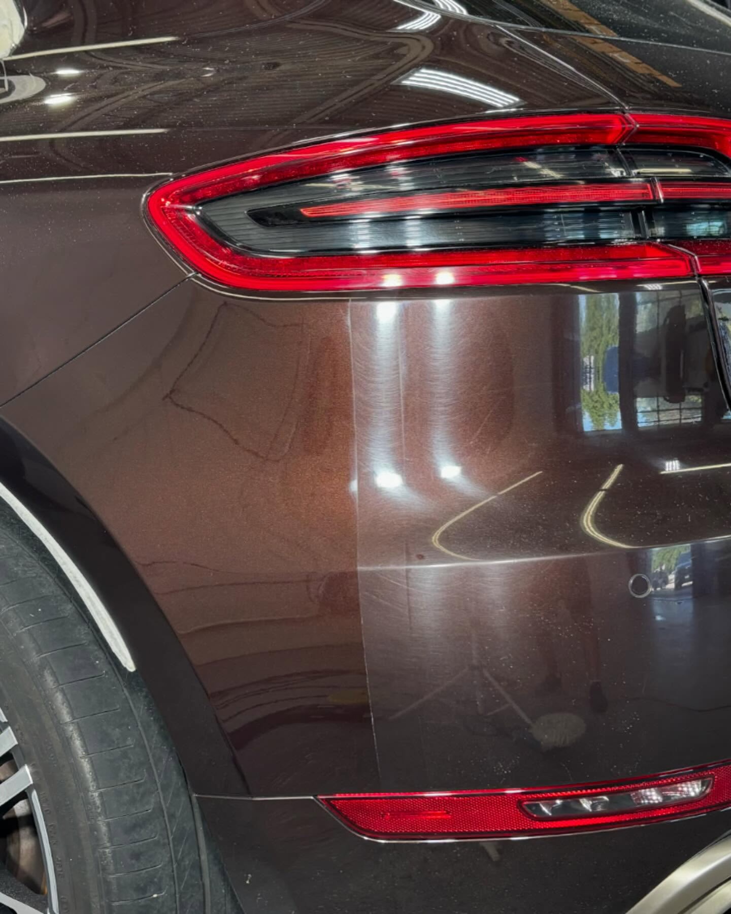 50/50 paint correction on a Porsche panel — swirls on one side, mirror gloss on the other